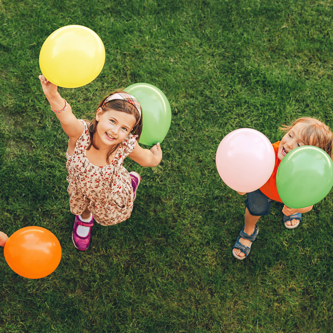 Children playing with balloons – easy party games for children that get everyone moving and laughing.